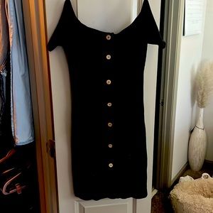Black off the shoulder dress.